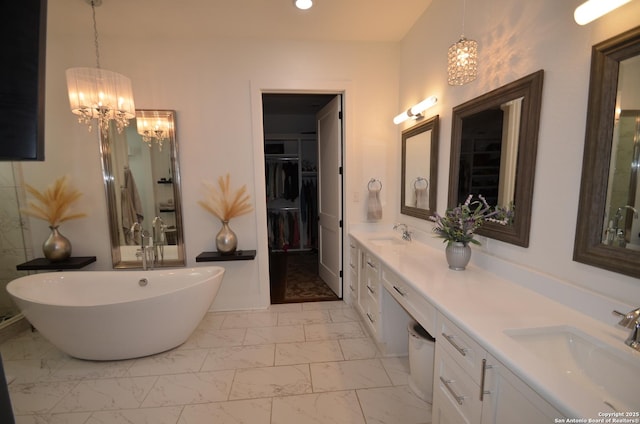 bathroom with vanity and a washtub