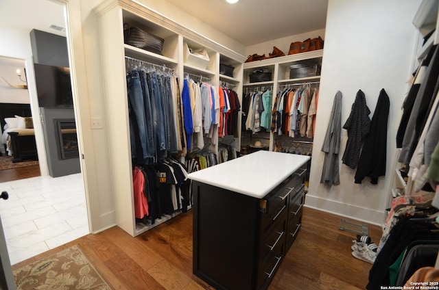 spacious closet with hardwood / wood-style flooring