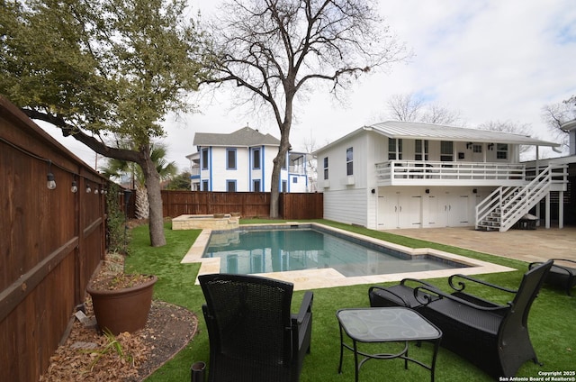 view of pool with a yard, a patio area, and a deck