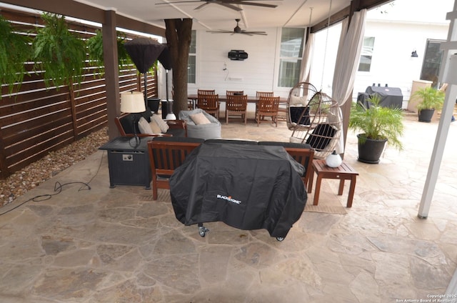 view of patio with a grill and ceiling fan