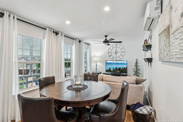 dining area featuring ceiling fan and a wall unit AC