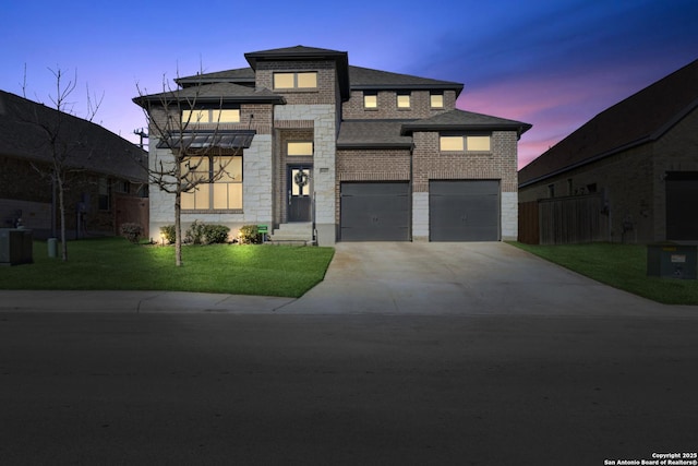 view of front of home with a garage, cooling unit, and a lawn