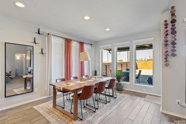 dining space featuring light wood-type flooring