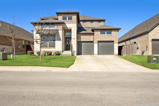 view of front of home featuring a garage and a front yard