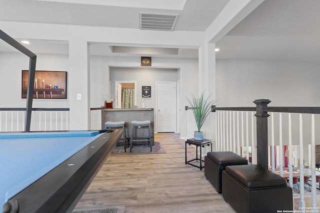 game room with light wood-type flooring