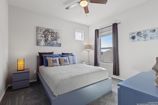 bedroom with dark carpet and ceiling fan