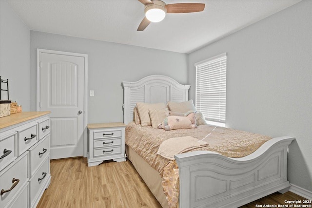 bedroom featuring ceiling fan and light hardwood / wood-style floors