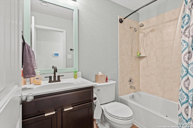 full bathroom featuring vanity, shower / bath combination with curtain, and toilet