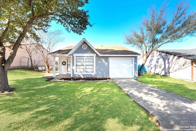 view of front of house with a garage and a front lawn