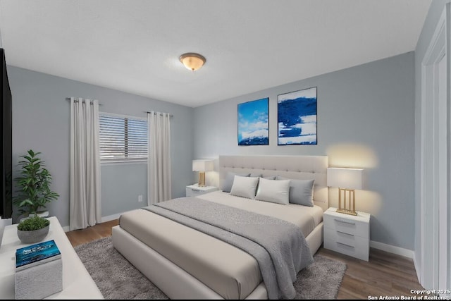 bedroom with wood-type flooring