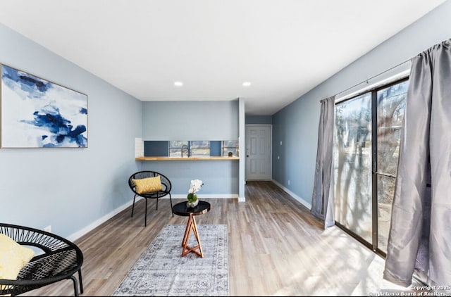 sitting room featuring light wood-type flooring