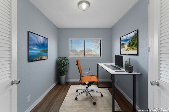 home office with dark wood-type flooring