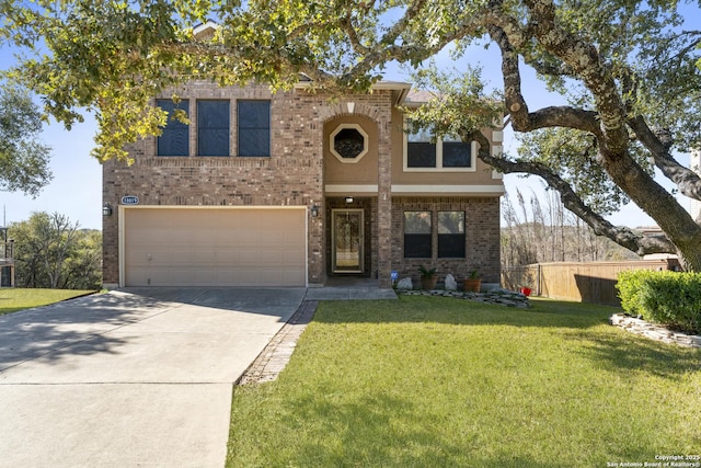 view of front of house featuring a garage and a front yard