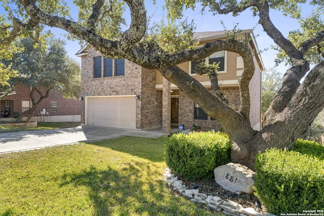 view of front of home with a garage and a front yard