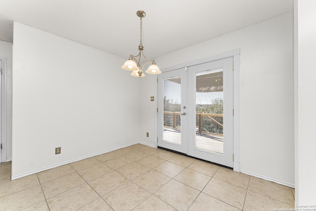 interior space featuring light tile patterned floors, a notable chandelier, and french doors