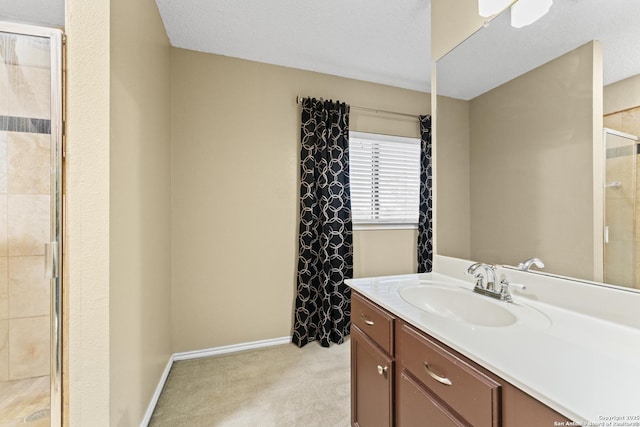 bathroom featuring vanity and a shower