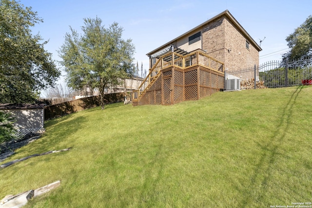 view of yard featuring a wooden deck and cooling unit