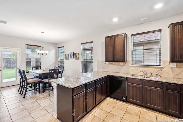 kitchen featuring sink, dark brown cabinets, hanging light fixtures, dishwasher, and kitchen peninsula