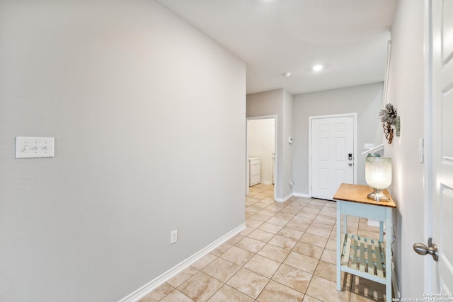 hallway with light tile patterned flooring