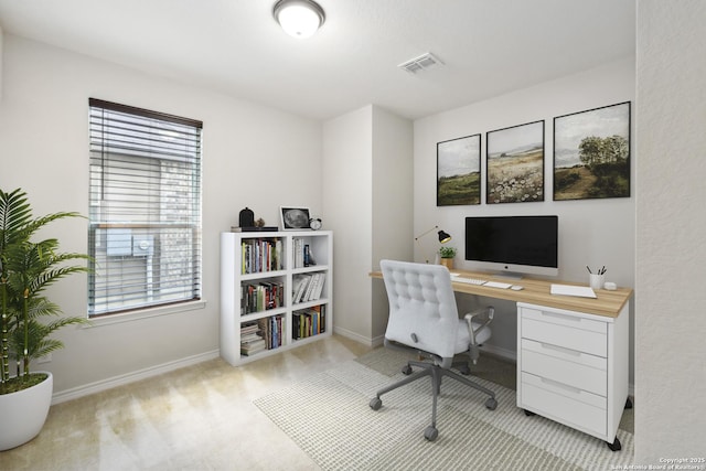 home office featuring light colored carpet