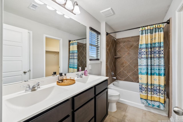 full bathroom with vanity, shower / bathtub combination with curtain, tile patterned floors, and toilet