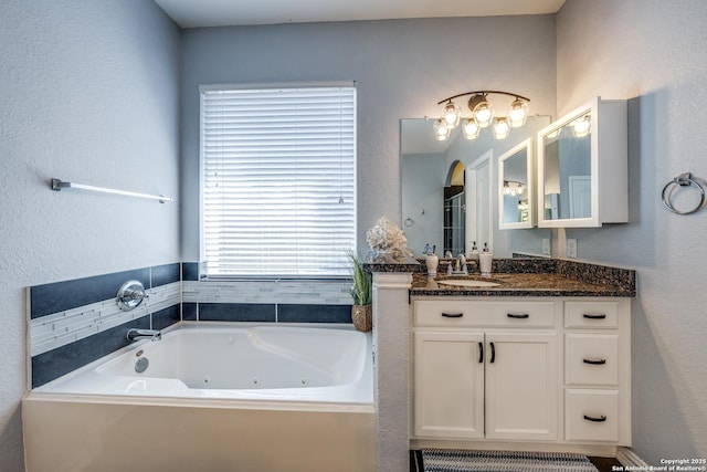 bathroom with vanity and a bathing tub