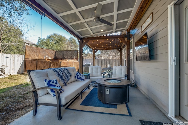 view of patio featuring an outdoor living space with a fire pit and ceiling fan