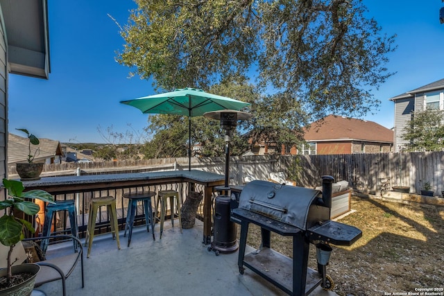 view of patio / terrace with a grill and an outdoor bar