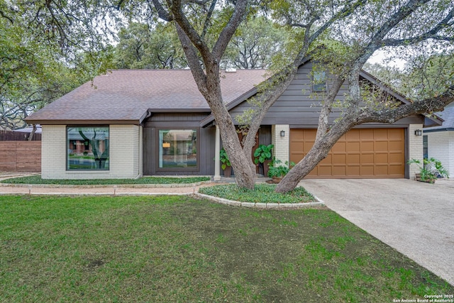 single story home with a garage and a front yard