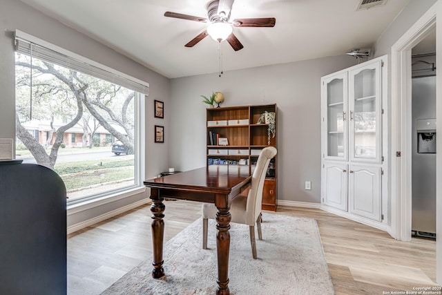 office area with ceiling fan and light wood-type flooring