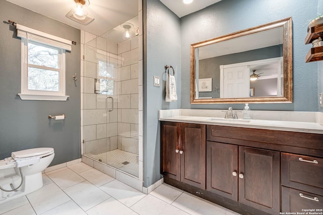 bathroom with vanity, tile patterned floors, toilet, and walk in shower