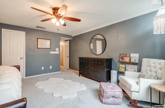 interior space with ceiling fan and light colored carpet