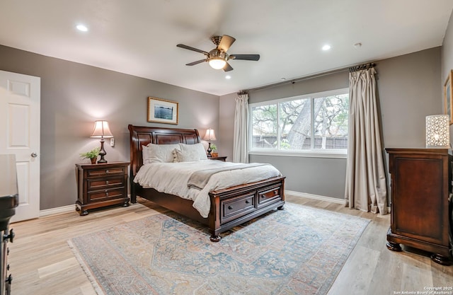 bedroom featuring light hardwood / wood-style floors and ceiling fan