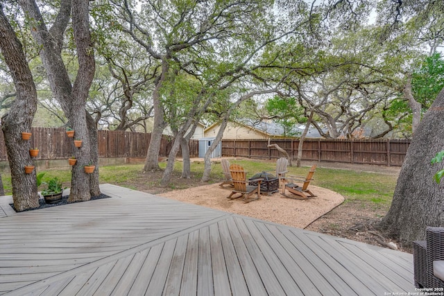 wooden deck featuring a fire pit