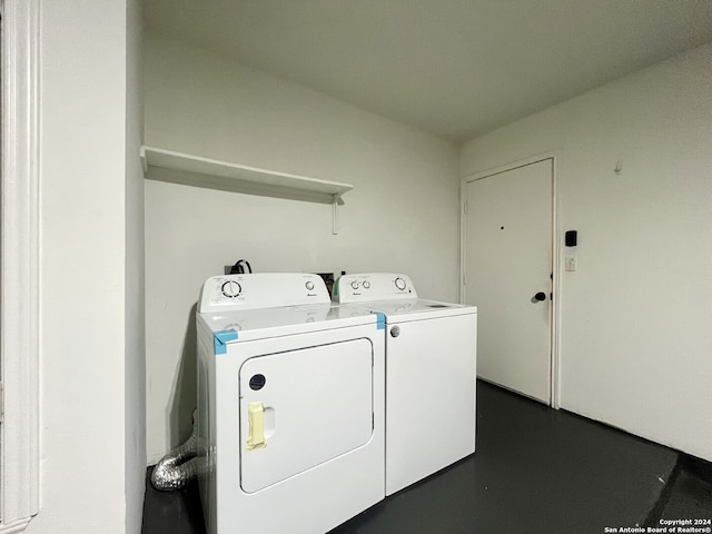 laundry room featuring washing machine and clothes dryer