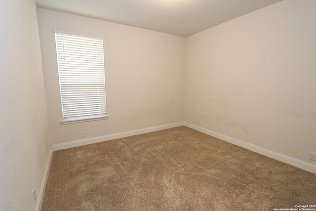 unfurnished room featuring carpet