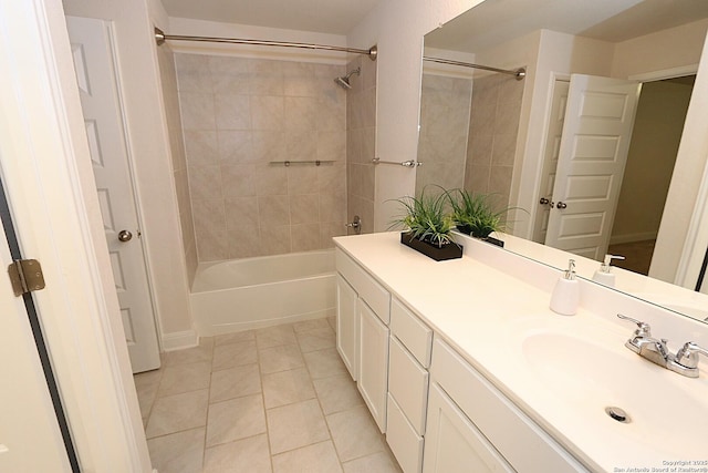 bathroom featuring vanity, tiled shower / bath combo, and tile patterned floors