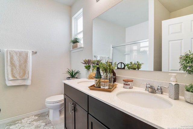 bathroom with vanity, toilet, and walk in shower