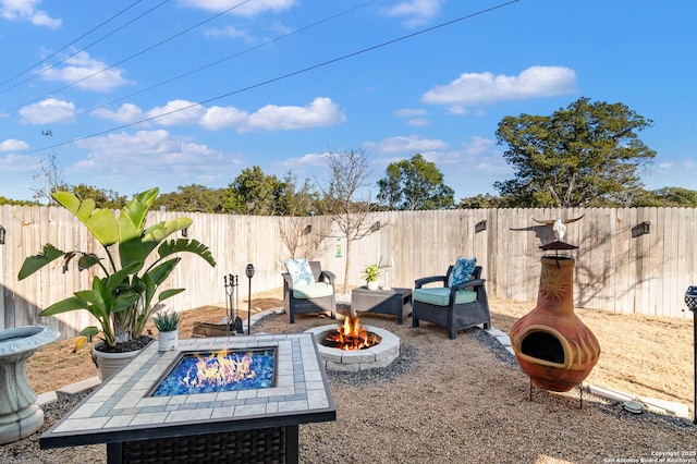 view of patio / terrace with an outdoor fire pit