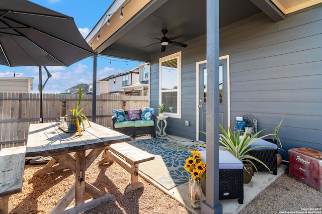 view of patio featuring an outdoor living space and ceiling fan