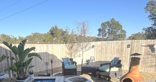 view of patio / terrace with a fire pit