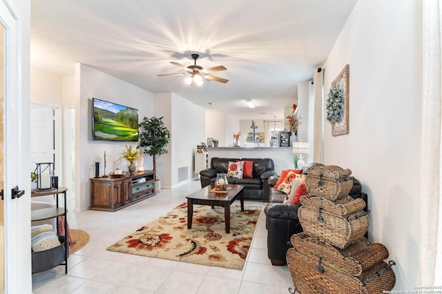 tiled living room with ceiling fan