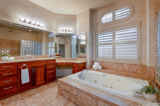 bathroom featuring vanity, tile patterned floors, tiled bath, and ceiling fan