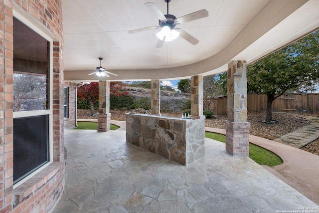 view of patio featuring ceiling fan