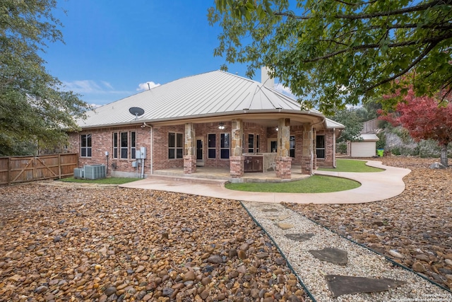 back of property featuring a patio area