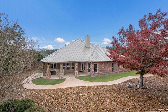 rear view of property with a patio