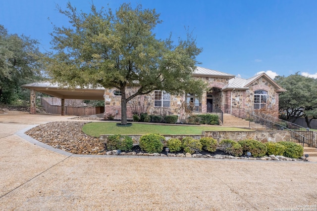 view of front of home with a carport