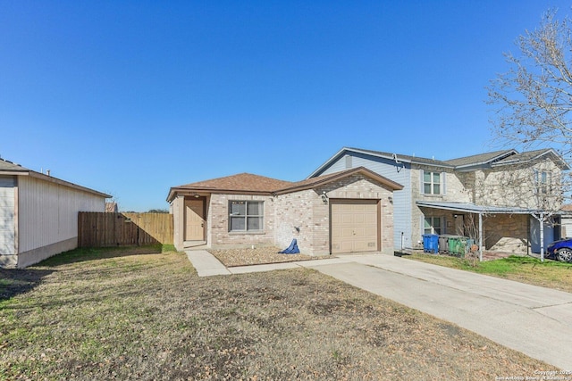 view of front of home with a garage and a front lawn