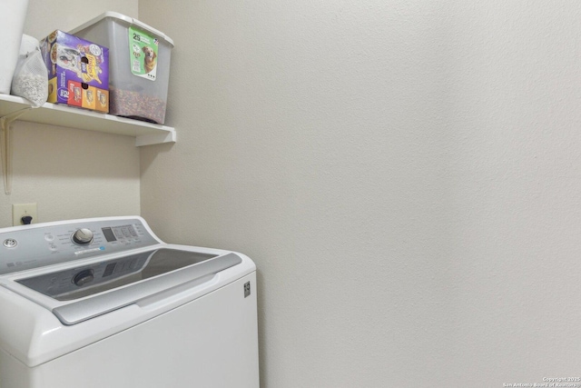 clothes washing area featuring washer / dryer