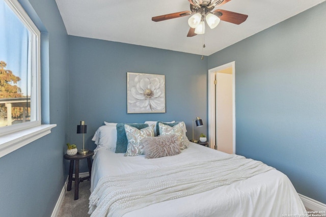 bedroom with ceiling fan and carpet flooring